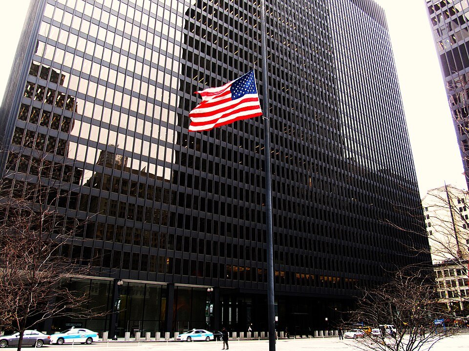Exterior of the Dirksen United States Courthouse in Chicago with a US flag.