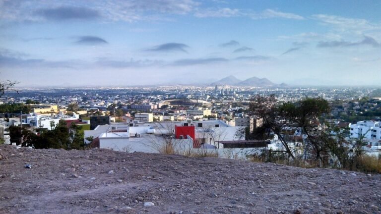 Panoramic view of Culiacán, Sinaloa, with the Tomateros baseball stadium and mountains in the distance