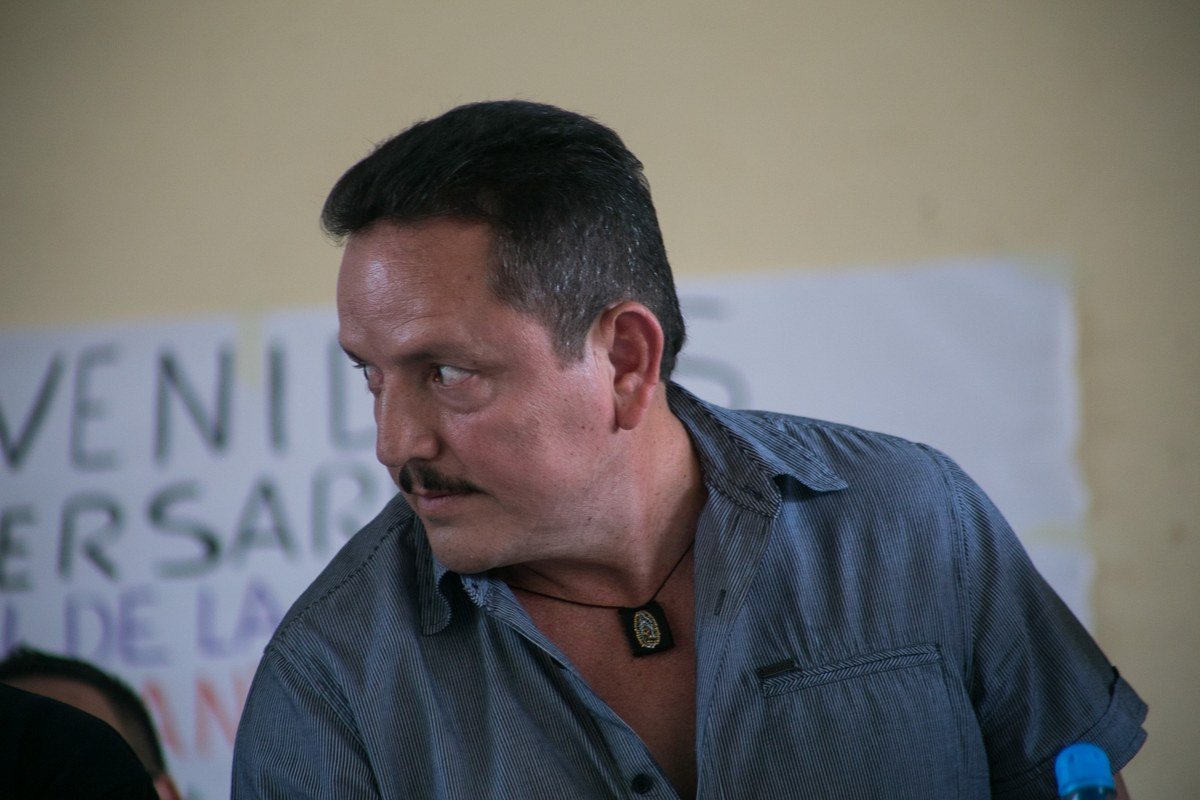Juan José Farías Álvarez, El Abuelo, glances sideways at a 2015 event in Tepalcatepec, Michoacán
