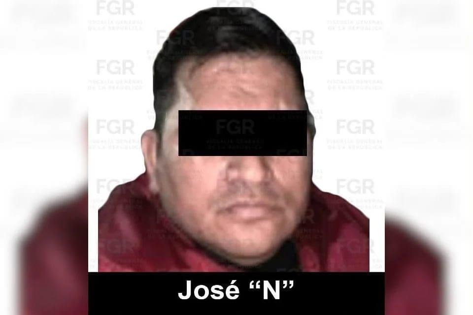 FGR identification photo of a man in a red jacket with a black bar over his eyes, captioned José N, on a background watermarked FGR
