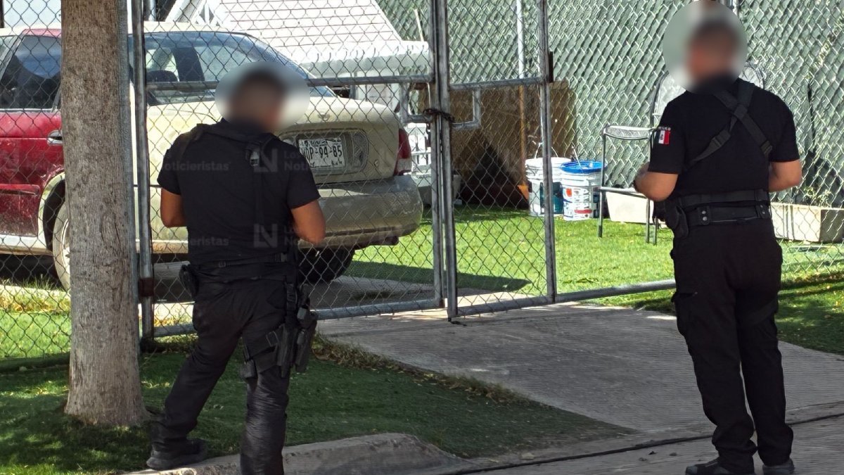 An Ahome municipal police truck behind red 'Peligro' tape on a street in Los Mochis, Sinaloa, after the Sept. 28, 2026 shooting