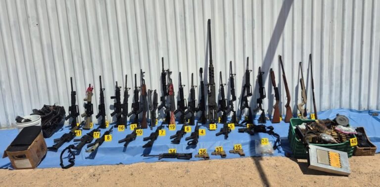 Rifles, a .50-caliber machine gun and ammunition seized from a cartel safe house in Puerto Peñasco, Sonora