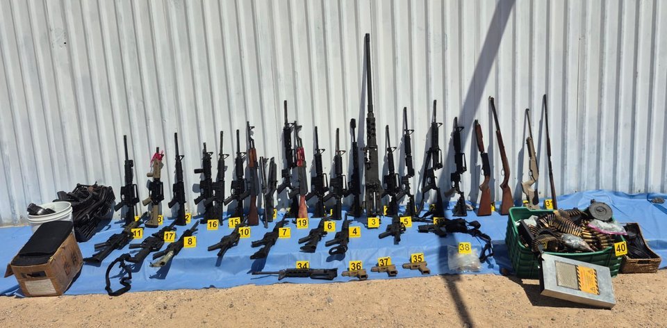 Rifles, a .50-caliber machine gun and ammunition seized from a cartel safe house in Puerto Peñasco, Sonora