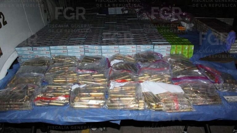 Boxes and bags of ammunition laid out on tables by Mexico's federal prosecutor's office after the seizure in Aguascalientes