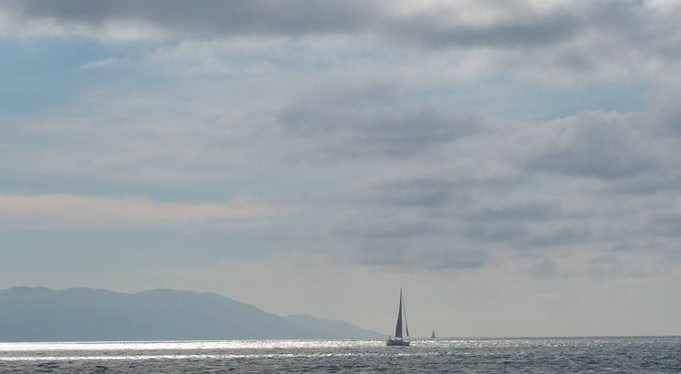 Los Arcos / sailboats under clouds off Puerto Vallarta