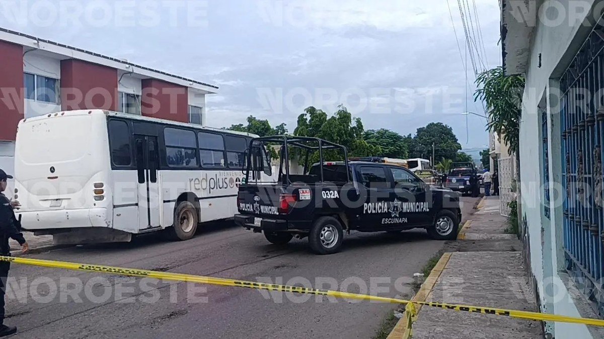 Escuinapa municipal police pickup and crime-scene tape on a street in central Escuinapa, Sinaloa