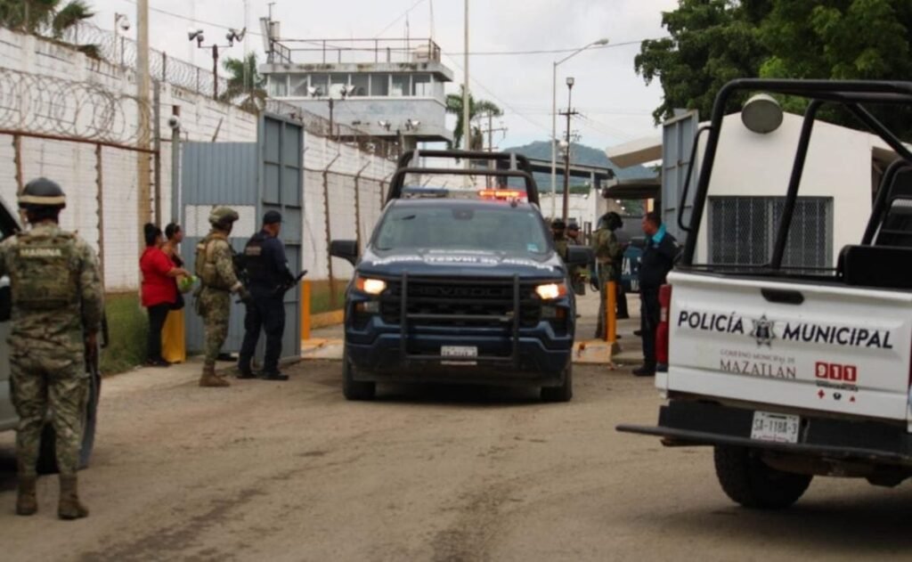 Navy troops, police and a patrol truck at the gate of El Castillo prison in Mazatlán, Sinaloa, after the deadly riot on Oct. 8, 2026